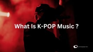 Vibrant concert scene featuring energetic K-pop performers on stage, surrounded by enthusiastic fans. The image captures the dynamic and visually appealing nature of K-pop music performances.