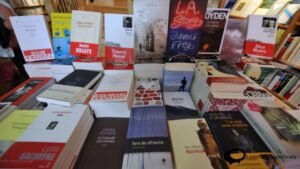 "Illustration depicting a stack of newly released books symbolizing La Rentrée Littéraire - 'La Rentrée Littéraire: A surge of new literary works.'"