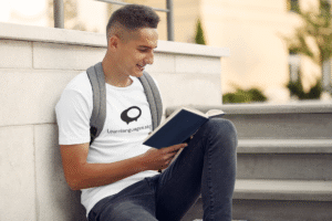 tee-mockup-of-a-student-reading-a-book-by-some-stairs-39173-r-el2
